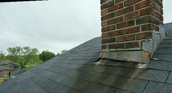 Failed flashing showing its rust signature at a chimney base